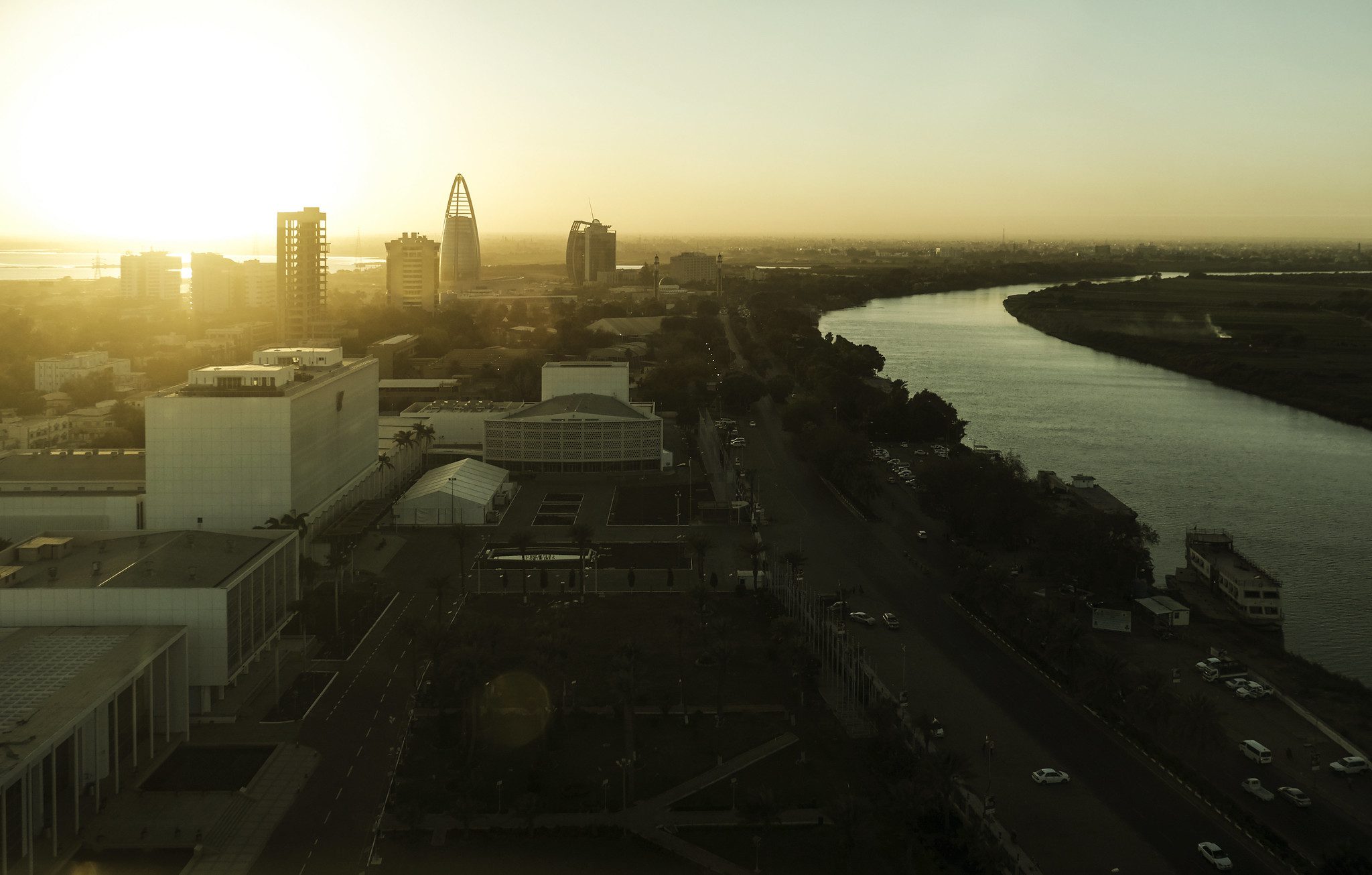 aerial view of city of Khartoum, buildings and river at sunset