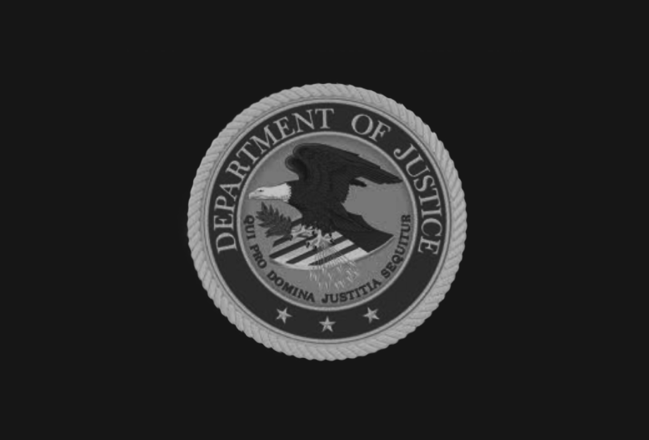Eagle in a circle, surrounded by words U.S. Department of Justice