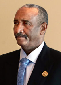Cropped photo headshot of General Abdel Fattah al-Burhan dark suit and blue tie