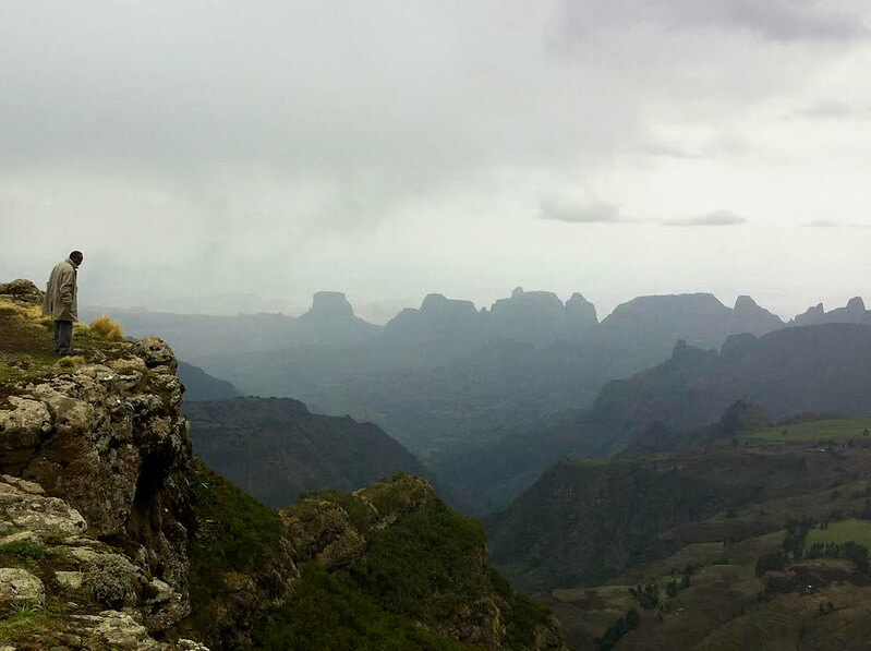 A representative of the Amhara Regional Government looks out over the Simien Mountains