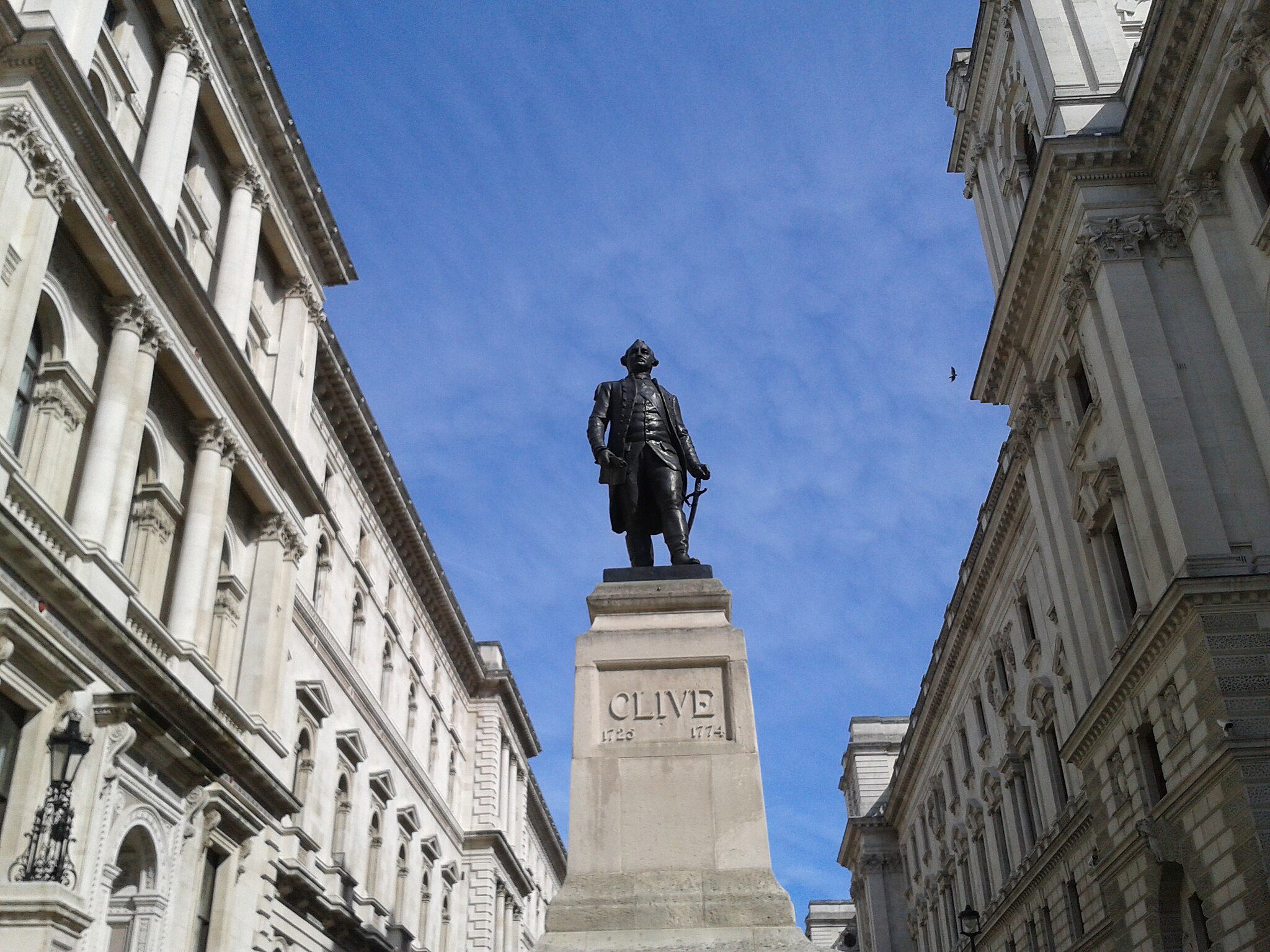 photo of statue of Robert Clive on pedestal between rows of buildings