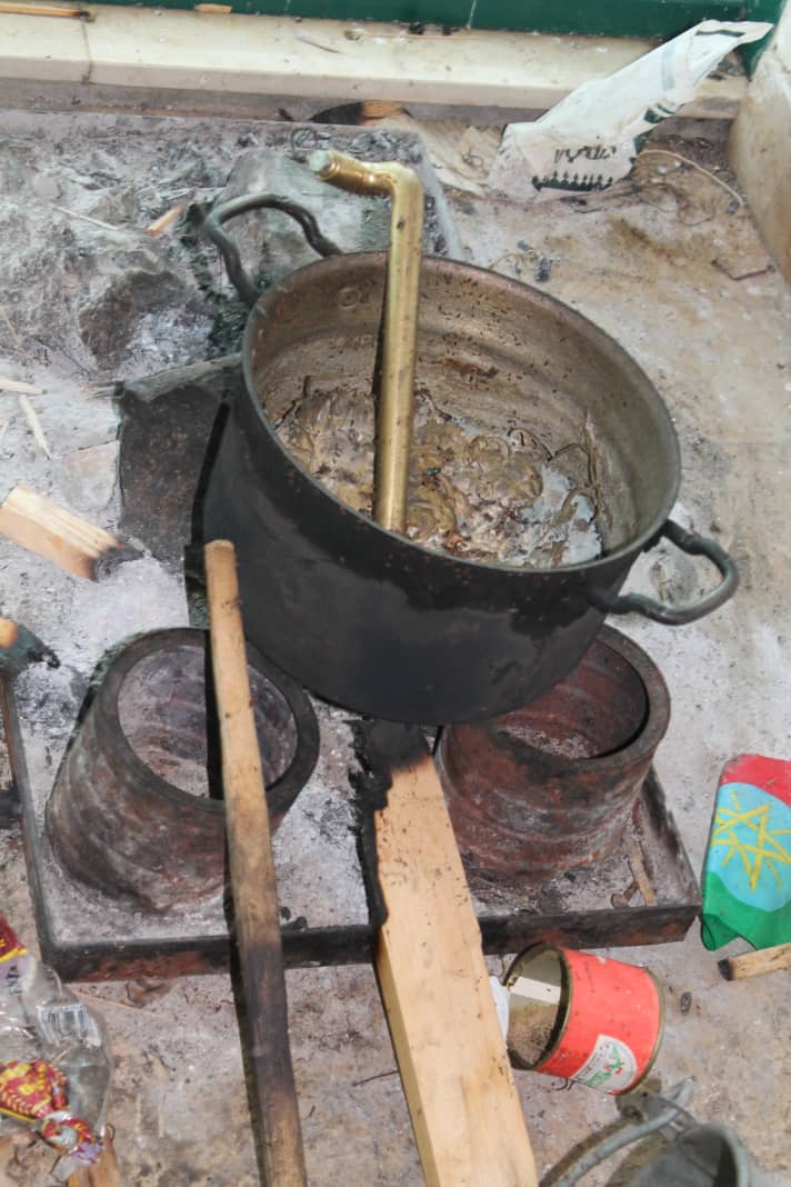 Cooking pot and ashes.