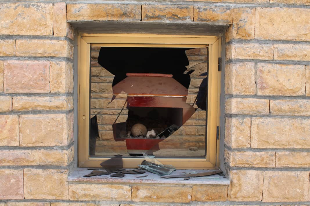 Stone wall with a broken window, revealing the desecrated remains of some soldiers killed in the 1974 – 1991 war against the Derg.