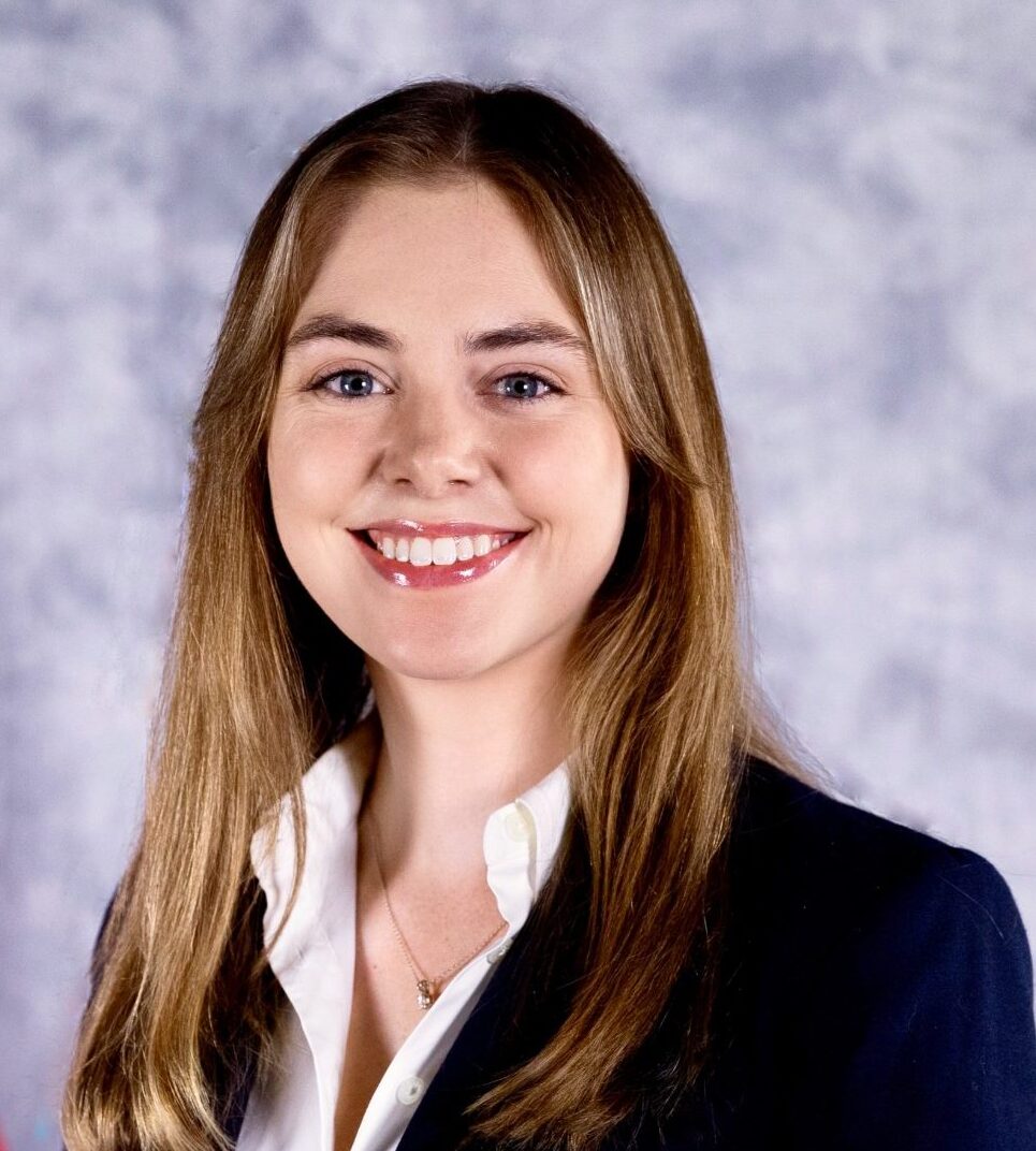 Headshot photo Emily Ruhm black suit white shirt