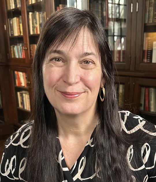 Caucasian woman with long brown hair smiling