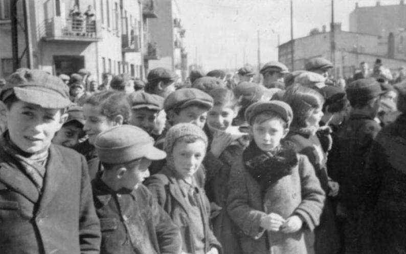 vintage black and white photo of group of small children gathering in the street