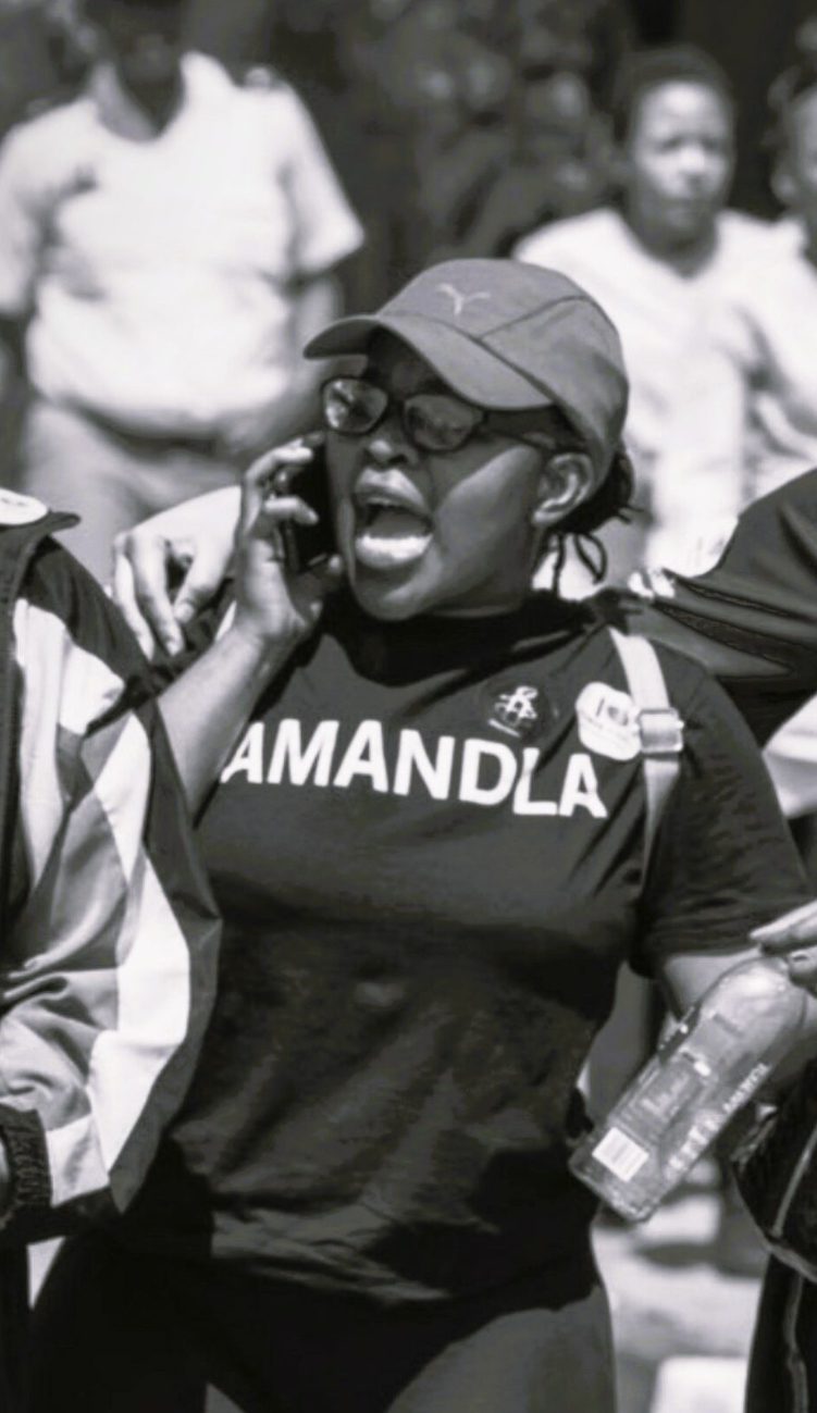 Black and white photo of a woman at a protest