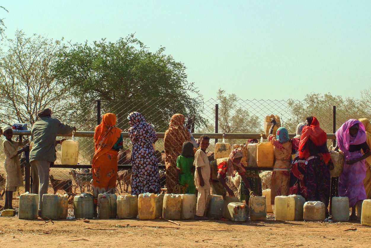 Sudanese women waiting in line to fetch water in Al Fashir, capital of North Darfur, Sudan